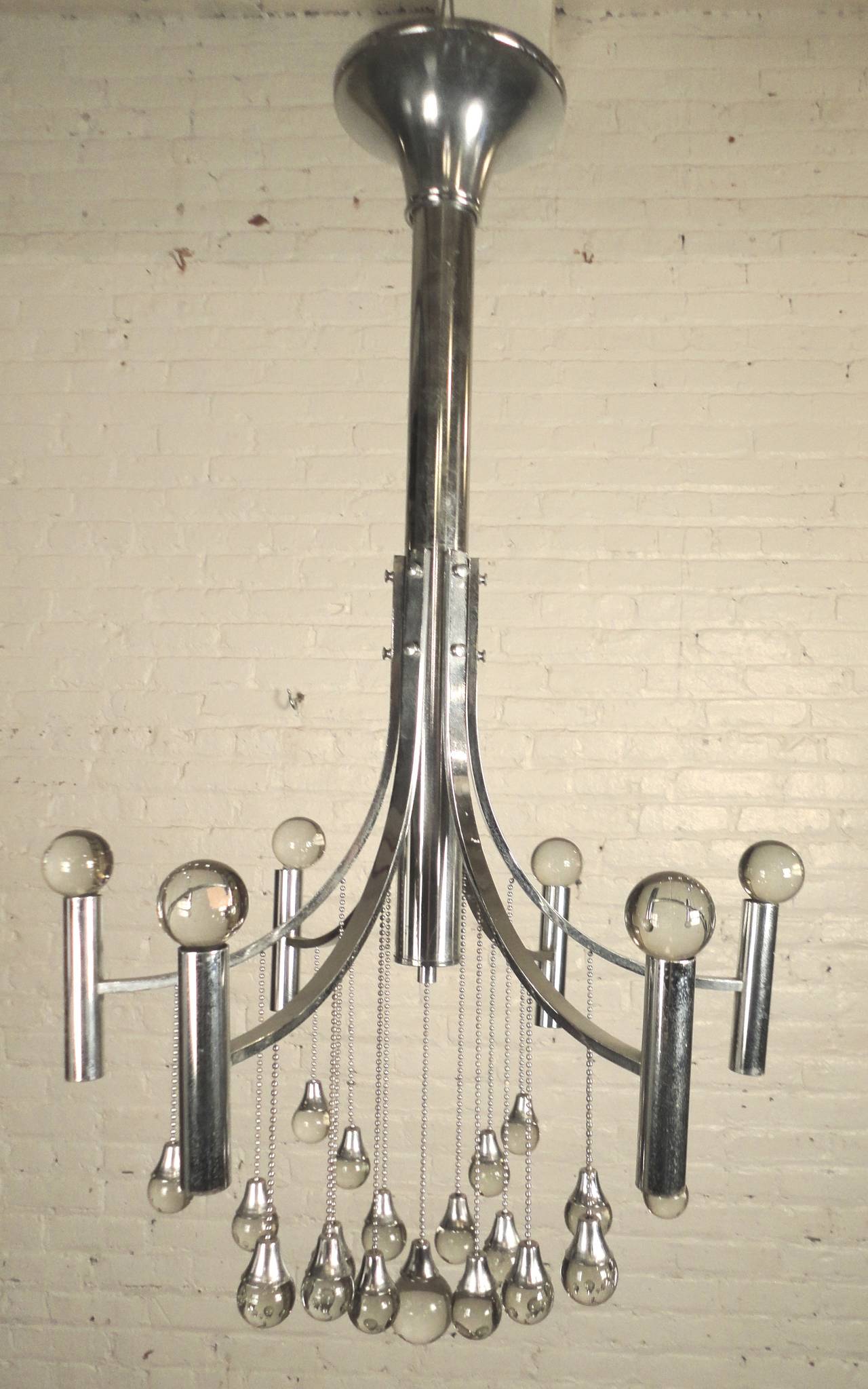 Mid-Century chrome frame chandelier by Gaetano Sciolari. Beautifully decorated with glass globes suspended by thin chains. Six bulbs hang downward.

(Please confirm item location - NY or NJ - with dealer).