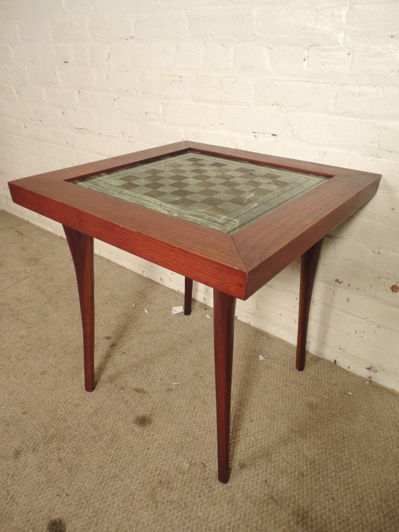 Vintage side table with marble chess or checkers inlay. Sculpted legs, wood frame, beautiful green marble with checkered pattern.

(Please confirm item location, NY or NJ, with dealer).