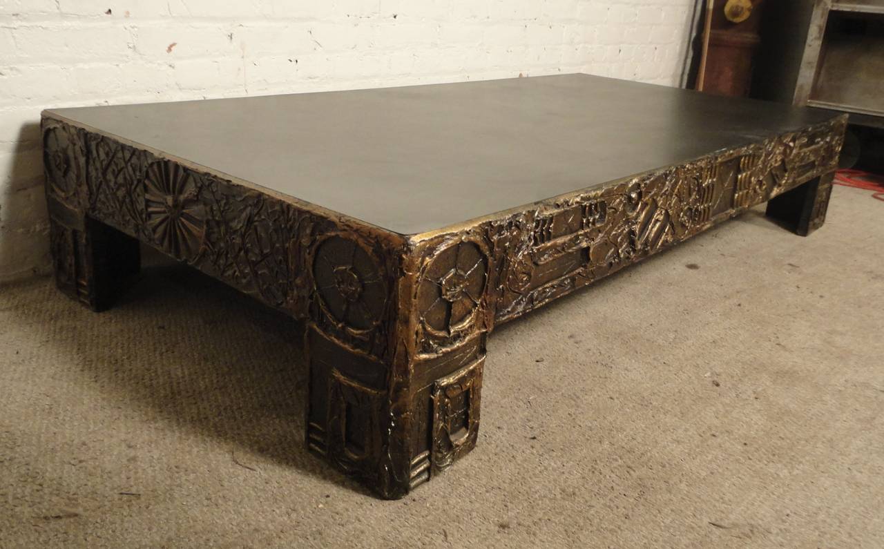 Excellent coffee table in sculpted resin by Craft Associates. In the style of Paul Evans, with hand made "brutalist" designs throughout the sides and legs.

(Please confirm item location - NY or NJ - with dealer)