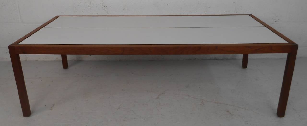 Vintage laminate top and walnut frame table with original Knoll label. Please confirm item location (NY or NJ) with dealer.