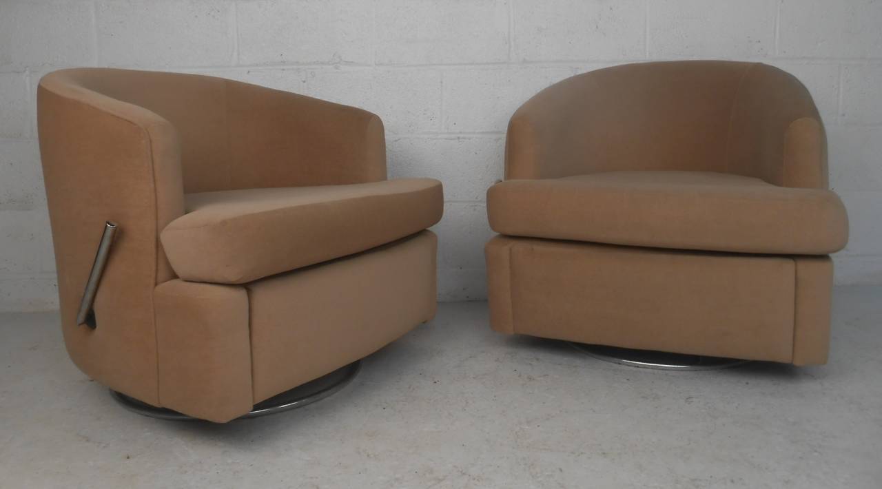 Great pair of Thayer Coggin lounge chairs with swivel bases and retractable footrests. Please confirm item location (NY or NJ) with dealer.