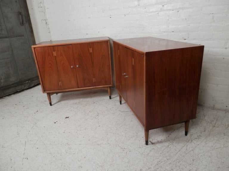 Newly re-finished two-door cabinets, both with a fixed shelf. Classic Lane dovetail inlay on the door and two tone tapered legs.

(Please confirm item location - NY or NJ - with dealer).
