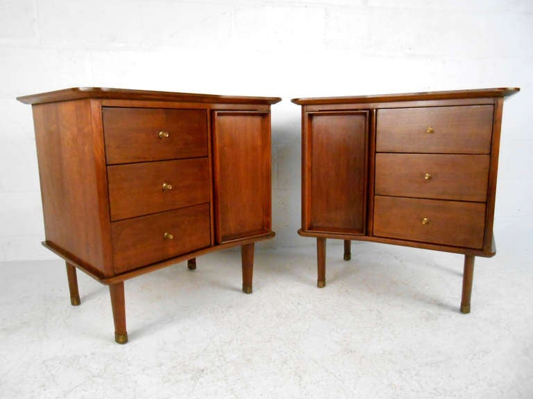 These unique nightstands offer three drawers and a separate cabinet for storage, featuring fantastic lines and mid-century drawer pulls. Please confirm item location (NY or NJ).