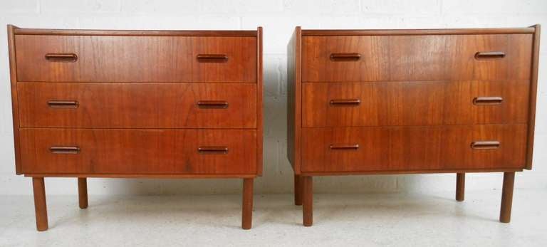 This pair of Scandinavian Modern dressers feature spacious storage with a rich natural wood finish. Made in Norway, this uniquely sized pair makes a great addition to any room, and look particularly smart when used as oversized bedside tables.