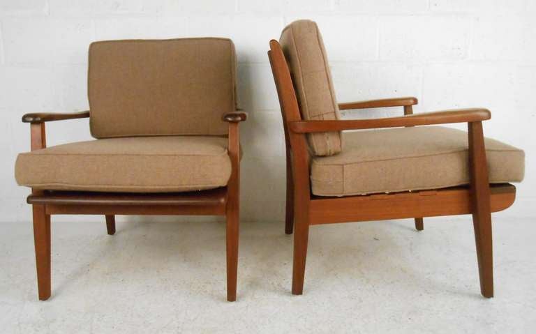 Handcrafted and signed Mid-Century Modern lounge chairs feature two tone solid wood construction. Craftstmanship shines through with this unique matched pair, handcrafted 1977. Please confirm item location (NY or NJ) with dealer.