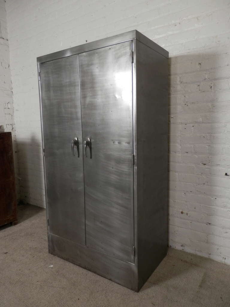 Industrial metal two door cabinet with multiple file drawers and safe. Outside has been striped and polished for a handsome metal look.

(Please confirm item location - NY or NJ - with dealer)