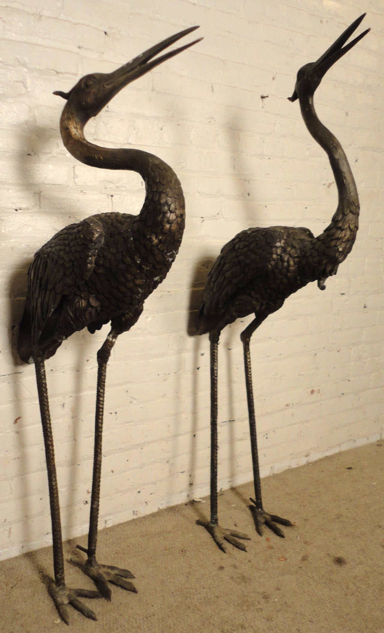 Pair of bronze fountain birds, spout for water, travels through foot and out of the mouth of the fountain. Great detailing throughout.

(Please confirm item location - NY or NJ - with dealer).