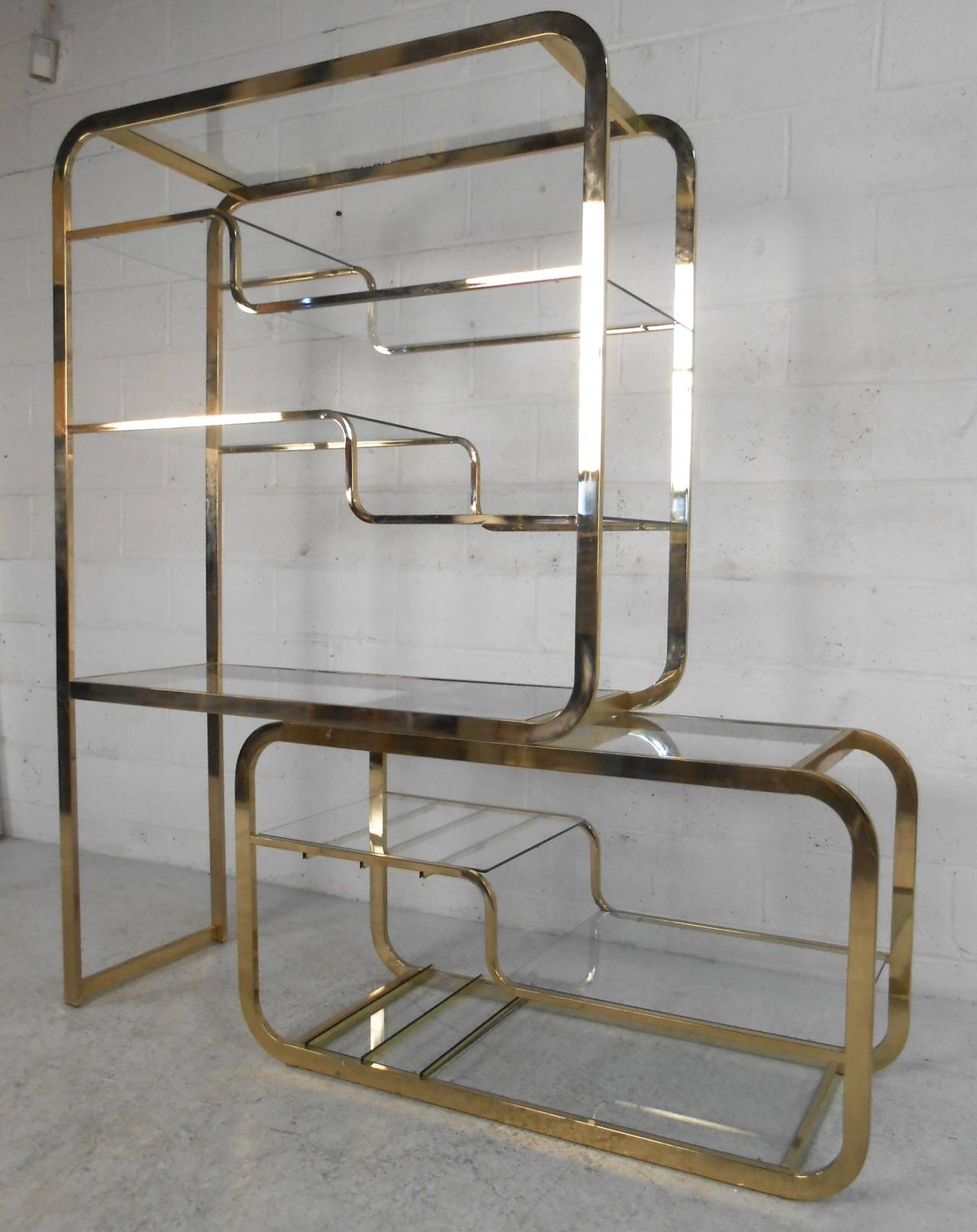 This wonderfully designed etagere features a perfect mixture of style and display space, suited to any home or business. Unique sliding two piece construction allows some customization on width, and makes a striking visual statement. Please confirm