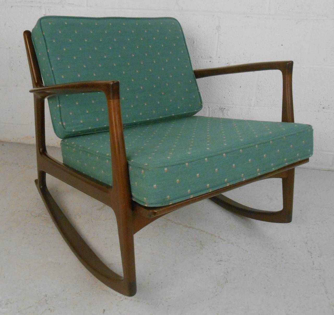 Comfortable and stylish rocker with walnut frame and upholstered seat & back. Please confirm item location (NY or NJ) with dealer.