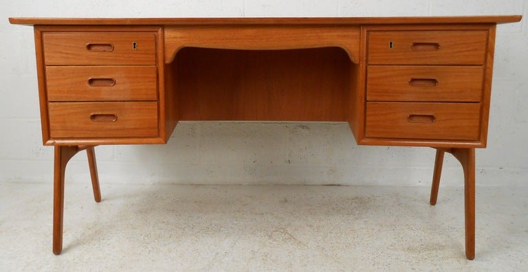 Freestanding teak desk by Svend Aage Madsen and produced by Sigurd Hansen, Denmark. Please confirm item location (NY or NJ) with dealer.