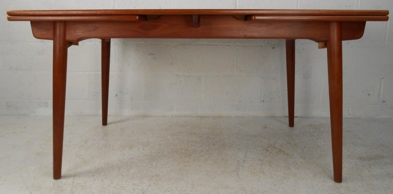 Hans Wegner draw leaf table for Andres Tuck and six Wegner CH-29 Sawback dining chairs. Table extends to 94