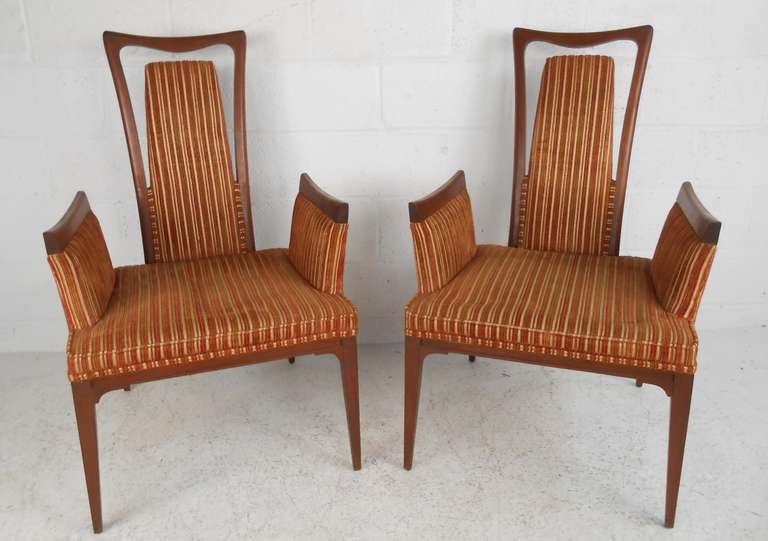 Unique pair of midcentury accent chairs feature sculptural hardwood frames, stylish vintage fabric, and eye-catching throne like design. Please confirm item location (NY or NJ) with dealer.