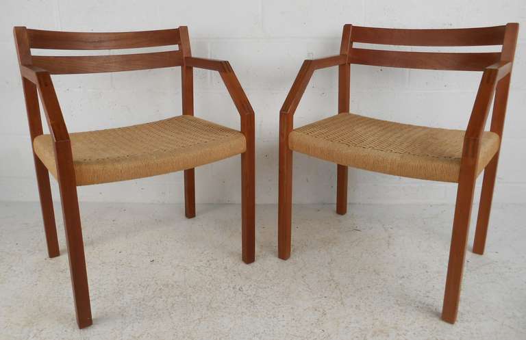 Wide Teak arm chair with rope seat, model number 404, designed in 1974 by Jorgen Henrik Moller for J.L. Mollers Mobelfabrik of Denmark. Please confirm item location (NY or NJ) with dealer.

Please confirm item location (NY or NJ) with dealer.
