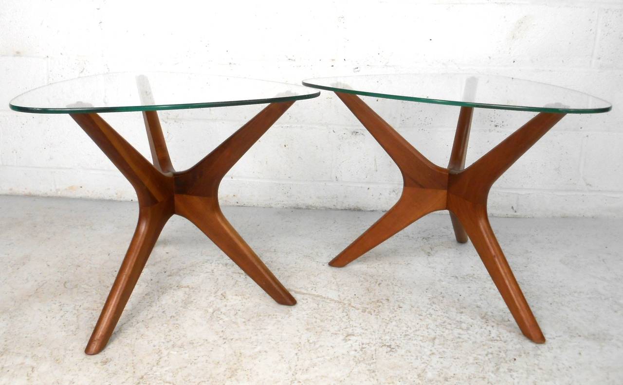 This beautiful pair of Jacks style end tables feature wonderfully sculpted and well balanced frames supporting triangular glass tops. Unique addition to any modern interior, home or business. Please confirm item location, (NY or NJ).