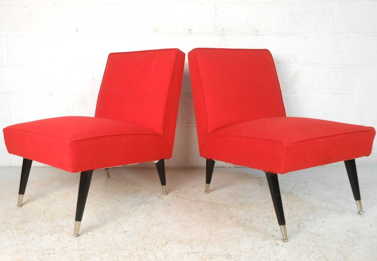 These beautifully upholstered slipper chairs feature comfortable and space saving design, tapered legs, and chrome capped feet. Unique shape and style makes these a great addition to any interior. Please confirm item location (NY or NJ).