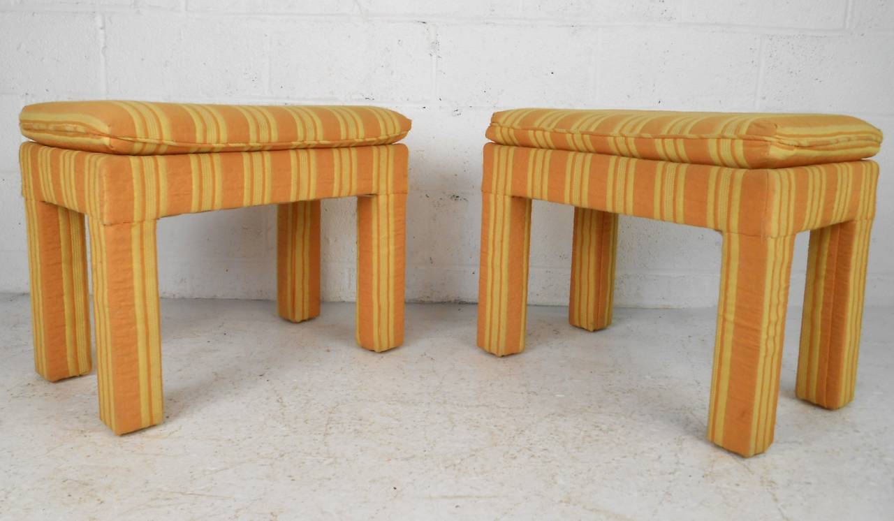 This unique pair of striped vintage stools offer a splash of color and mid-century style to any room in the home. Please confirm item location (NY or NJ).