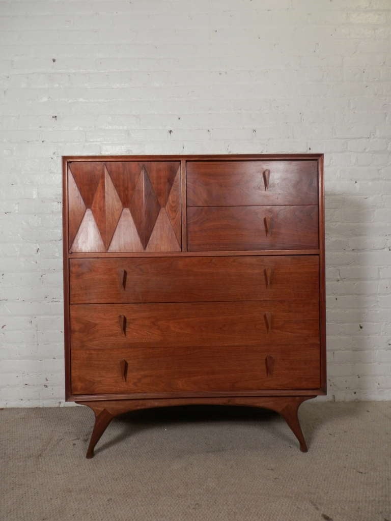 Gorgeous mid-century tall dresser with exaggerated legs, tear drop handles and diamond front cabinet door. The cabinet door opens easily with a push catch latch, the drawers run smoothly on metal slide tracks. 

(Please confirm item location - NY