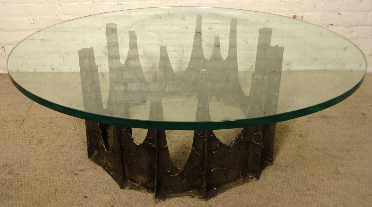 Vintage modern Paul Evans coffee table with wild Brutalist base. Thick round glass, sculpted bronze stalagmite base. Signed and dated 1969.

(Please confirm item location - NY or NJ - with dealer).