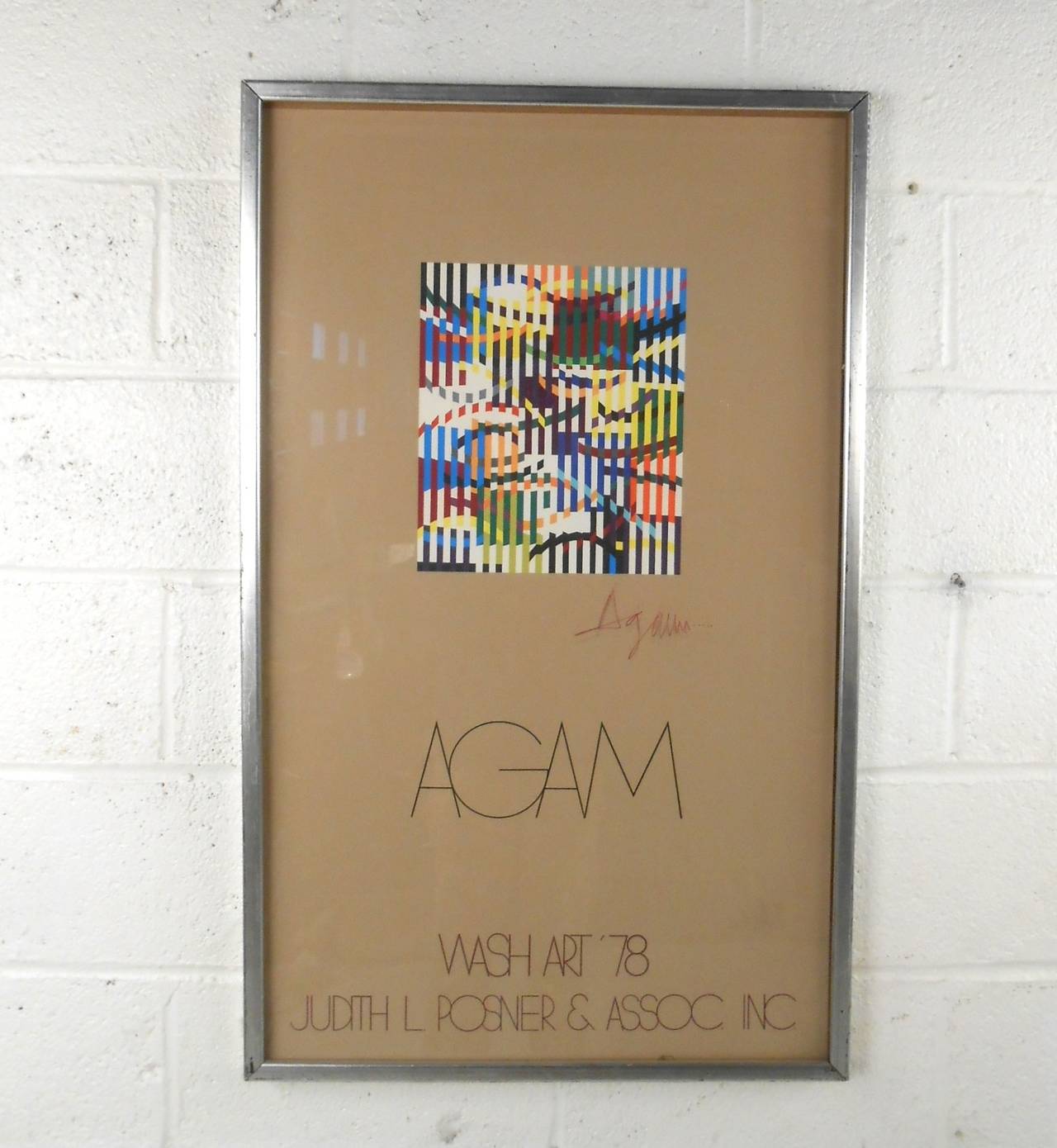 This unique piece by Yaacov Agam adds unique midcentury flair to any wall. Vibrant colors with modern typography make this a wonderful reminder of the midcentury era. Please confirm item location (NY or NJ).