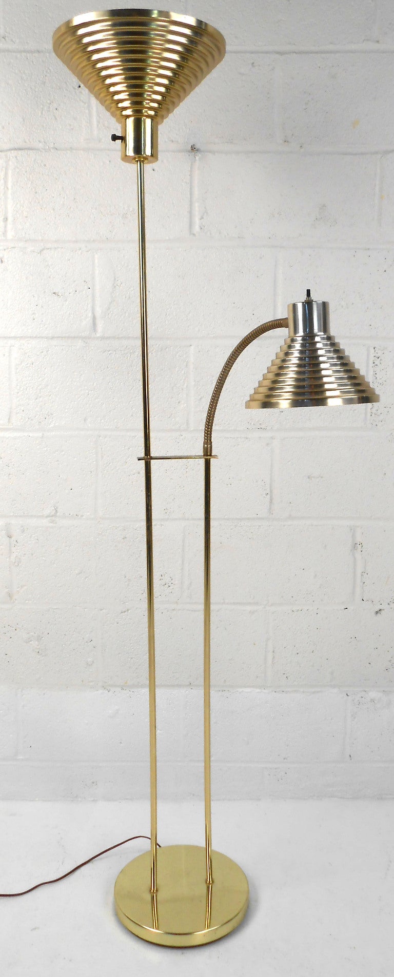 This stylish brass floor lamp has both a room and reading light, and features stylish Italian modern design. 

Please confirm item location (NY or NJ).