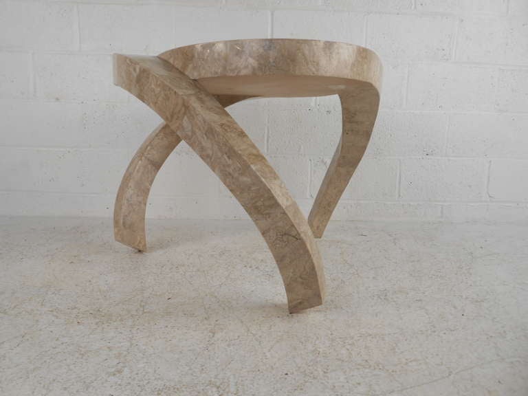 This uniquely designed end-table features well laid tessellated stone with beautifully made hurricane style legs. In the manner of extraordinary stone designer Maitland Smith. A truly eye-catching piece for home or business.

Please confirm item