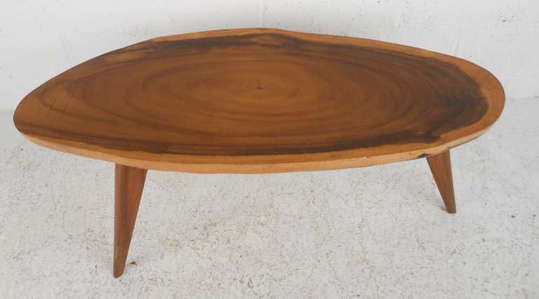 Oval shaped tree slab table with beautiful growth pattern. Please confirm item location (NY or NJ) with dealer.