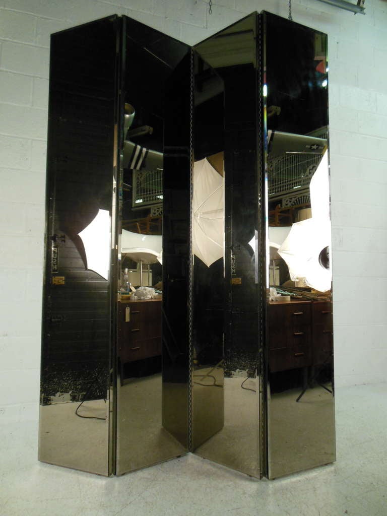 Beautiful beveled four panel mirrored screen/divider with white back. Please confirm item location (NY or NJ) with dealer.