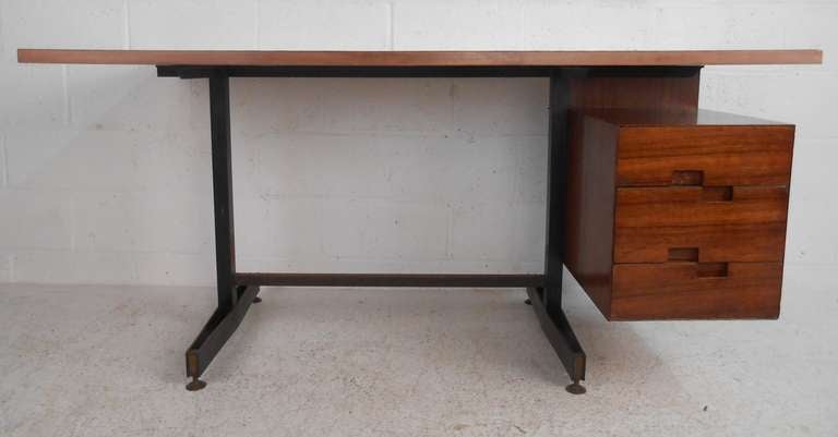 Italian design, stylish three-drawer desk with metal base and black laminate top. Please confirm item location (NY or NJ) with dealer.