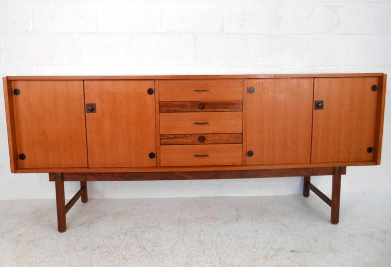 With unique two-tone center drawers and stylish cabinet and drawer pulls this vintage Italian server makes a wonderful addition to any home. Please confirm item location (NY or NJ).
