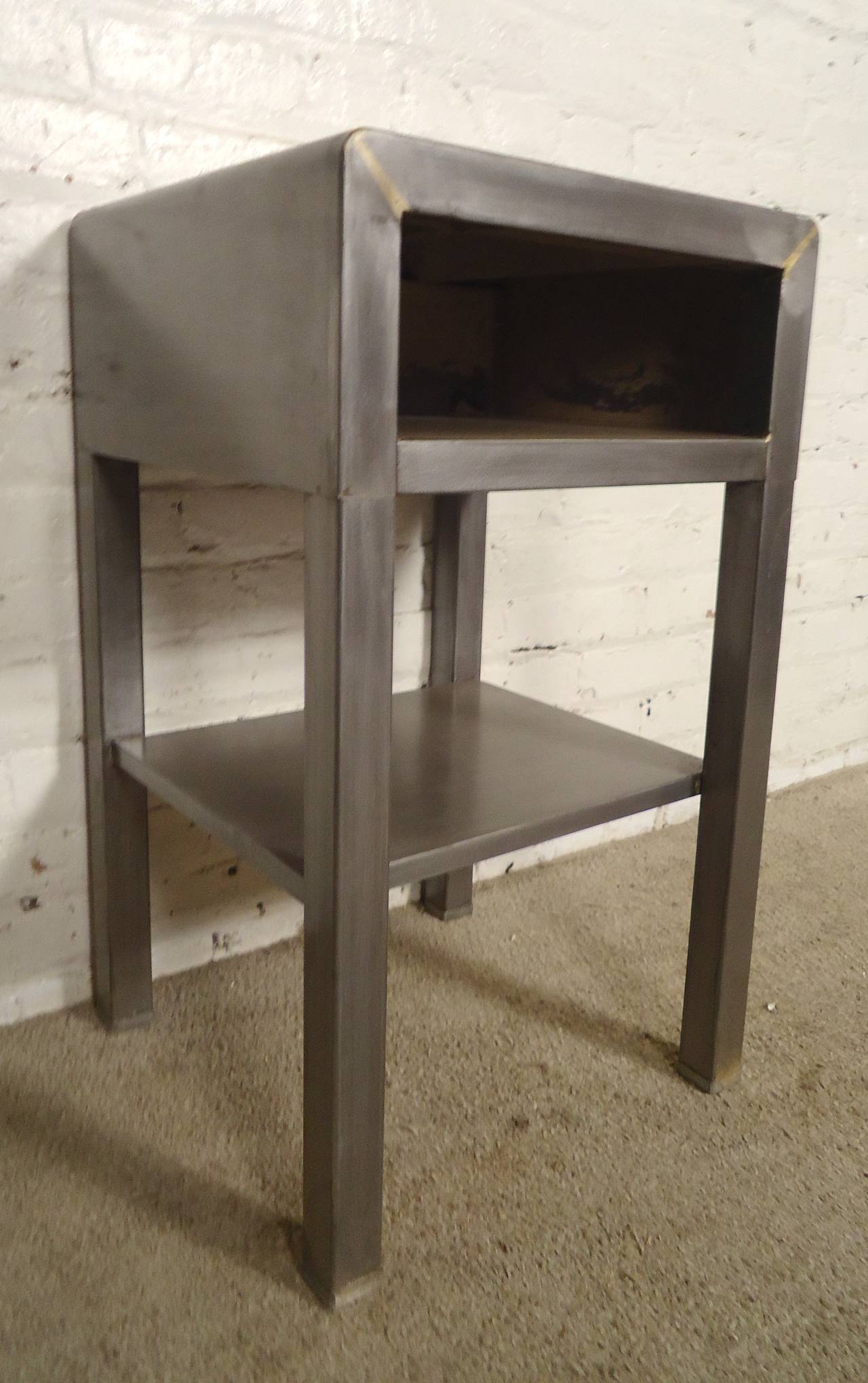 Vintage modern bedside table designed by Norman Bel Geddes. Stripped metal style, giving a handsome look to your sofa table, nightstand, or even as a bathroom table.

(Please confirm item location - NY or NJ - with dealer)