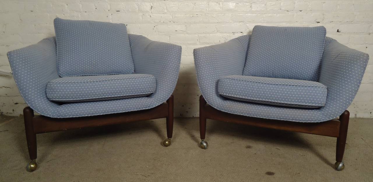 Vintage modern pair of Adrian Pearsall chairs featuring unique three sculpted legs on brass wheels. Designed for Craft Associates, they feature a comfortable rounded frame set on an unusual three leg base. Well built and designed by one of