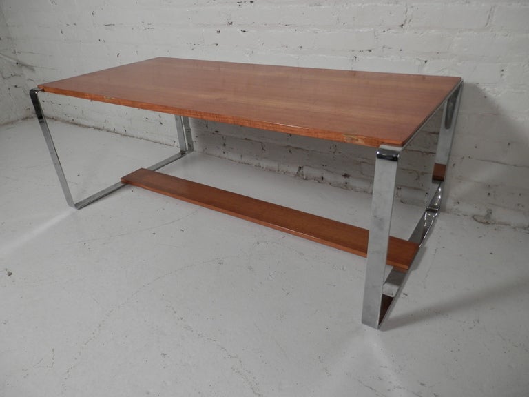 Vintage style coffee table with teak top and polished chrome frame. 

(Please confirm item location - NY or NJ - with dealer)