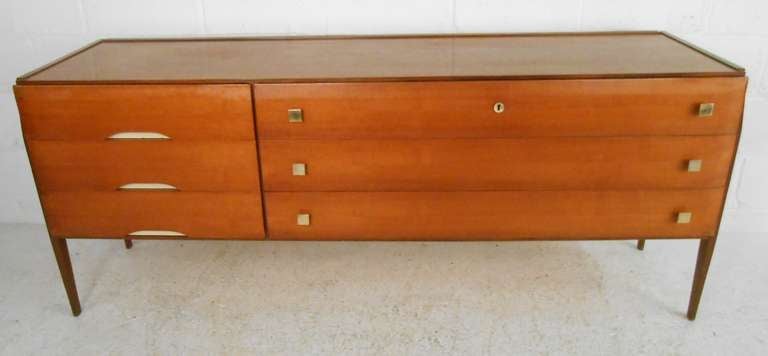 Stylish Italian modern six-drawer dresser with brass pulls and side mount legs. Please confirm item location (NY or NJ) with dealer.