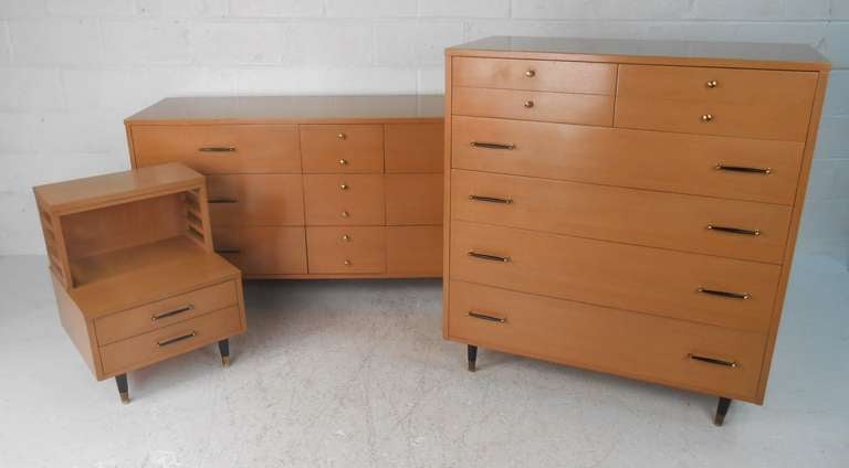Stylish three-piece bedroom suite consisting of tall dresser, long low dresser and single nightstand. Vintage natural wood finish makes a memorable statement while spacious drawers allow for plenty of storage in any interior. Manufactured by R-Way
