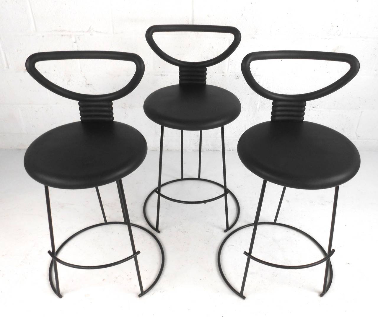 This set of three uniquely designed barstools combine comfort and modern style for a welcome addition to any seating situation. Twenty-four inch seat height make these ideal for counter seating. Please confirm item location (NY or NJ).