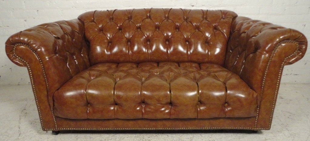Dramatic, smaller scale sofa with accentuated lines.