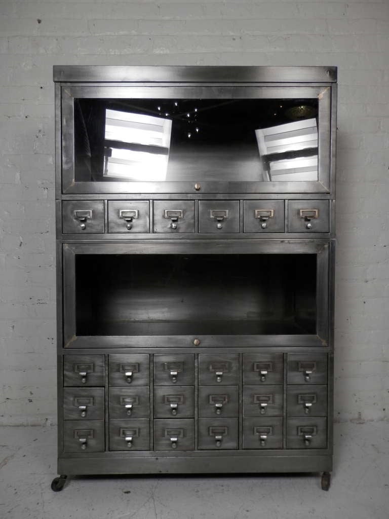 Industrial metal file cabinet with two barrister bookcases on casters. Striped and lacquered for a handsome machine age look. 

(Please confirm item location - NY or NJ - with dealer)