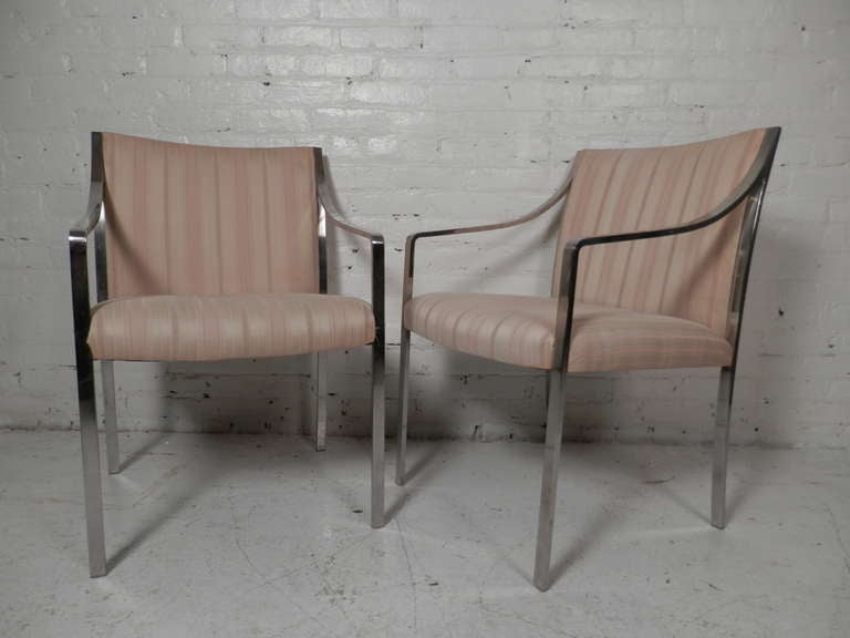 Classy pair of open arm chairs by the Stow Davis Furniture Company. Shaped back and down swept arms give a comfortable and stylish look to these durable chairs.

(Please confirm item location - NY or NJ - with dealer)