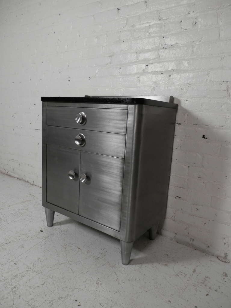 Vintage medical cabinet with two drawers and two door cabinet with shelf. Piece has been striped to bare metal and lacquered.

(Please confirm item location - NY or NJ - with dealer)