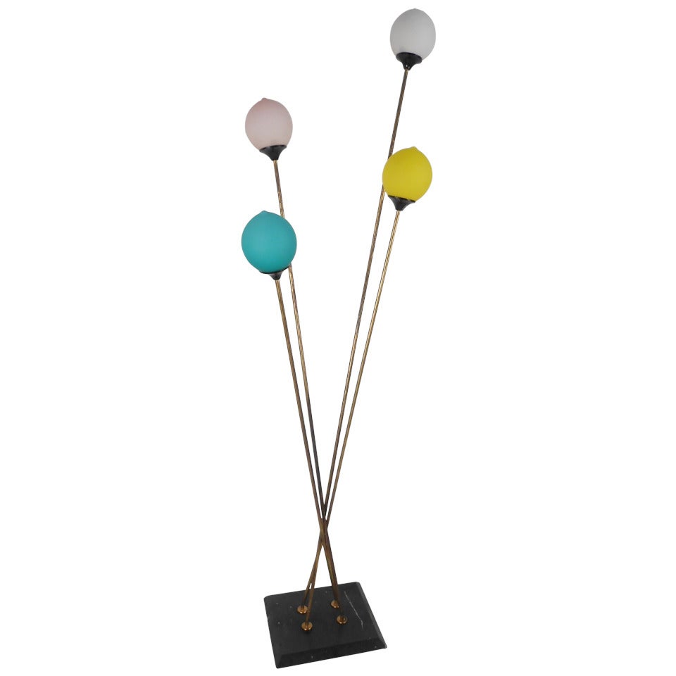 Stylish and striking, four-light floor lamp with frosted glass shades, marble base and brass-plated arms. Suggestive of balloons on strings, this is an ideal fixture for a children's room. Please confirm item location (NY or NJ) with dealer.