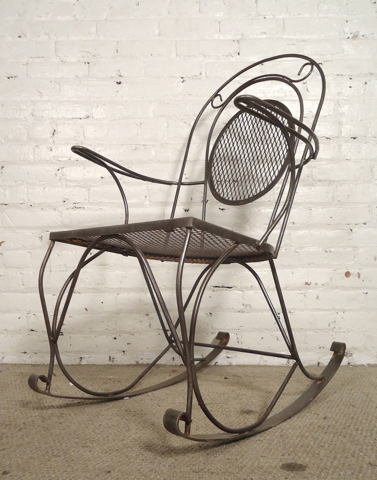 Vintage rocker with scrolling detail. Mesh seat and back, curling arms and legs. All stripped down and restored to a bare metal style finish.

(Please confirm item location - NY or NJ - with dealer)