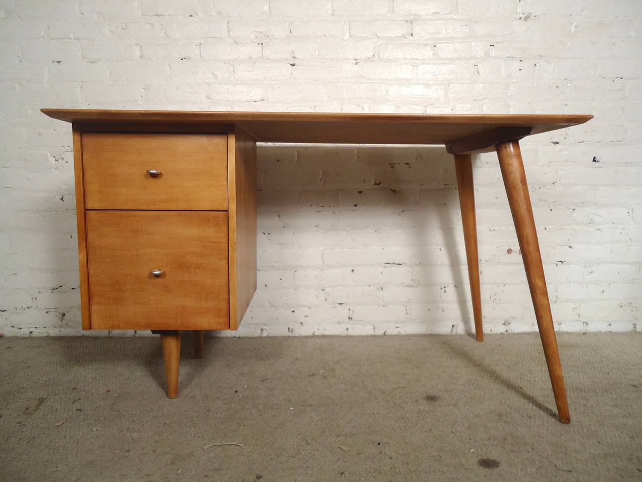 A Paul McCobb desk from the Planner Group line. Two left side drawers with the 