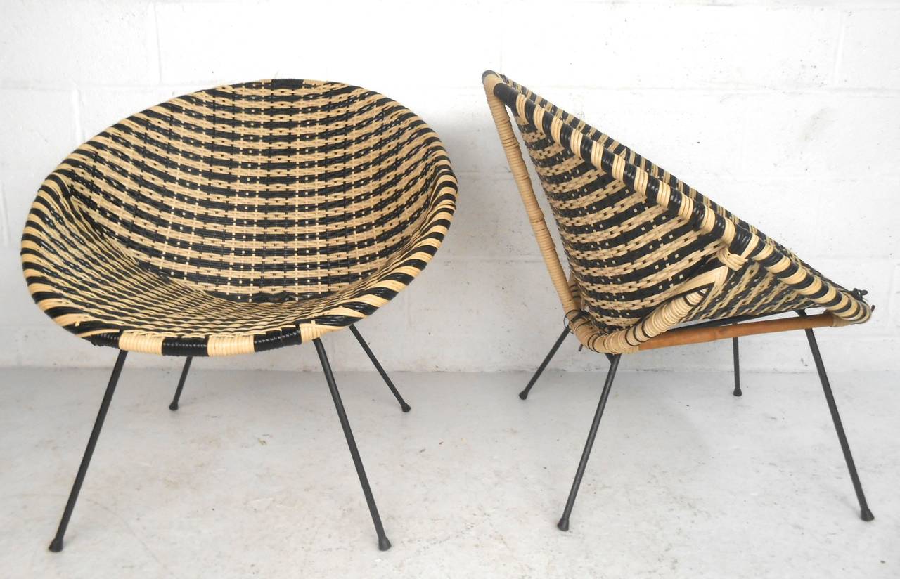 This pair of vintage woven nylon side-chairs feature Salterini style design and make a wonderful pair for indoor or patio use. Cast iron base combined with rattan style frames make these especially unique. Please confirm item location (NY or  NJ).