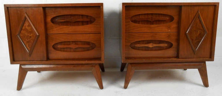 These beautiful sliding door nightstands make a unique addition as bedside tables or living room end tables. Rich walnut finish with sculptural design makes a stylish pair of storage tables in any setting. 

Please confirm item location (NY or NJ).