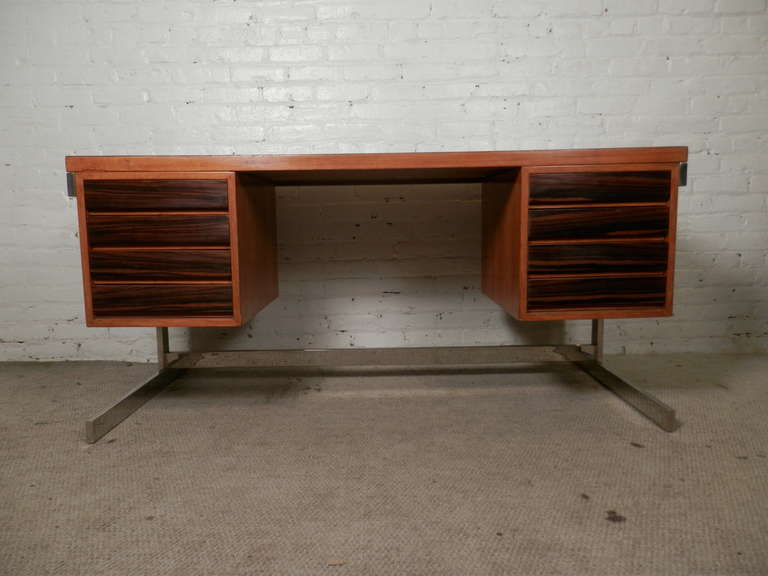 Double pedestal desk in exquisite rosewood grain with blonde teak trim on a Milo Baughman style chrome base. The back is finished, strong frame, eight drawers. Rich and deep grain patterns.

(Please confirm item location - NY or NJ - with dealer)