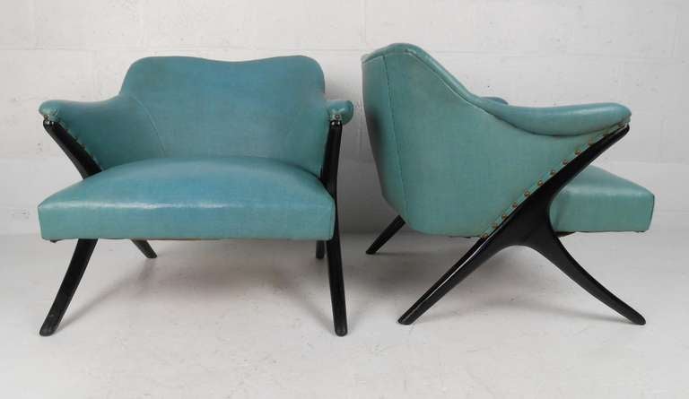 Pair of vintage lounge chairs with original vinyl upholstery. Please confirm item location (NY or NJ) with dealer.
