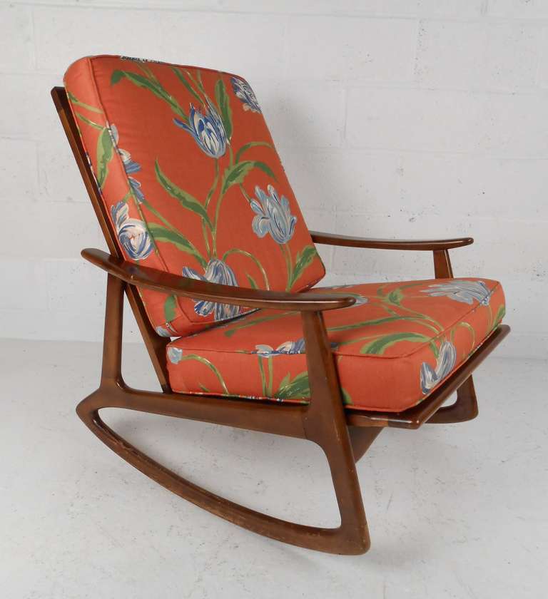 Stylish mid-century rocking chair in walnut. Please confirm item location (NY or NJ) with dealer.