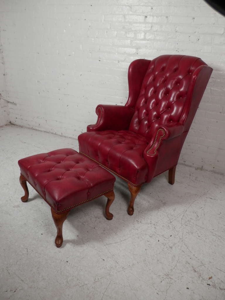 High back reading chair complete with rolled arms, deep wings, tufted back cushion and brass nail heads. Very good wear and patina to the leather.

(Please confirm item location - NY or NJ - with dealer)