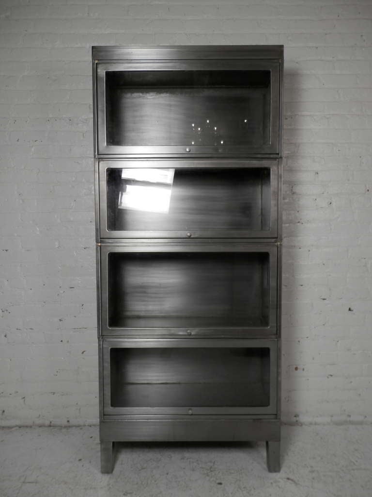 Modular glass fronted Library Book Case or dust resistant Storage. Originally used to store law books and at military bases. Has been striped to bare metal and lacquered.

(Please confirm item location - NY or NJ - with dealer)