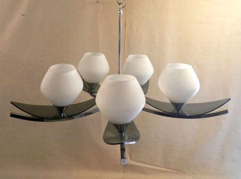 Stunning mid-century chrome chandelier. Diffused light from the five white glass globes and tinted lucite leaves creates a graceful modern effect.

(Please confirm item location - NY or NJ - with dealer)